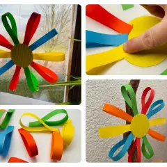 Bunte Papierblumen basteln Kinder leicht. Aus Papierstreifen entstehen Blumen, die man aufhängen kann.