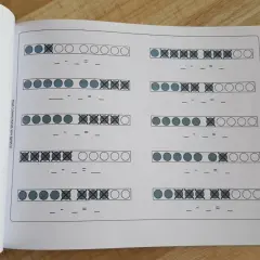 Übungsblatt zum Minus rechnen bis 10 mit Kreisen, die teilweise durchgestrichen sind.