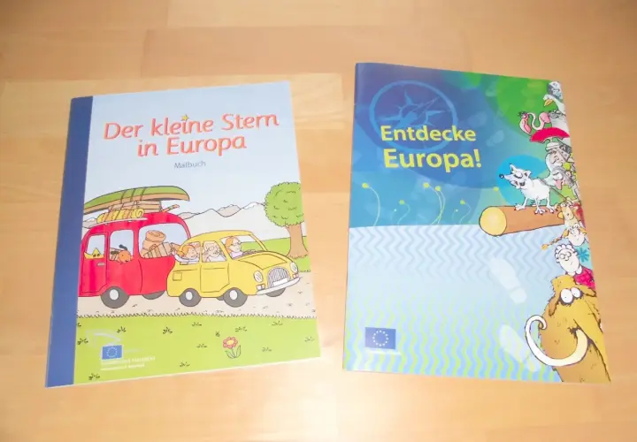 Zwei bunte Bücher für die **Europa Grundschule**: "Der kleine Stern in Europa" (Malbuch) und "Entdecke Europa!".
