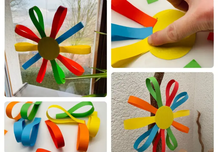 Bunte Papierblumen basteln Kinder leicht. Aus Papierstreifen entstehen Blumen, die man aufhängen kann.