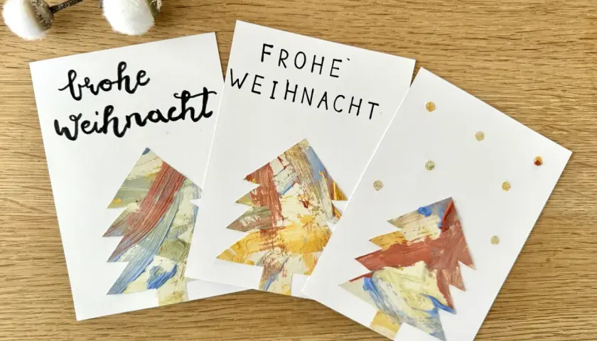 Drei selbstgebastelte Weihnachtskarten mit bunten Bäumen – tolle Ideen zum Weihnachtskarten basteln mit Kindern!