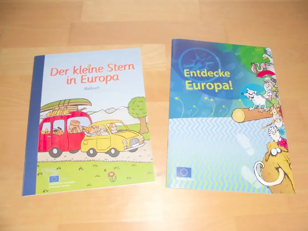 Zwei bunte Bücher für die **Europa Grundschule**: "Der kleine Stern in Europa" (Malbuch) und "Entdecke Europa!".