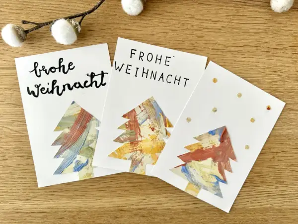 Drei selbstgebastelte Weihnachtskarten mit bunten Bäumen – tolle Ideen zum Weihnachtskarten basteln mit Kindern!
